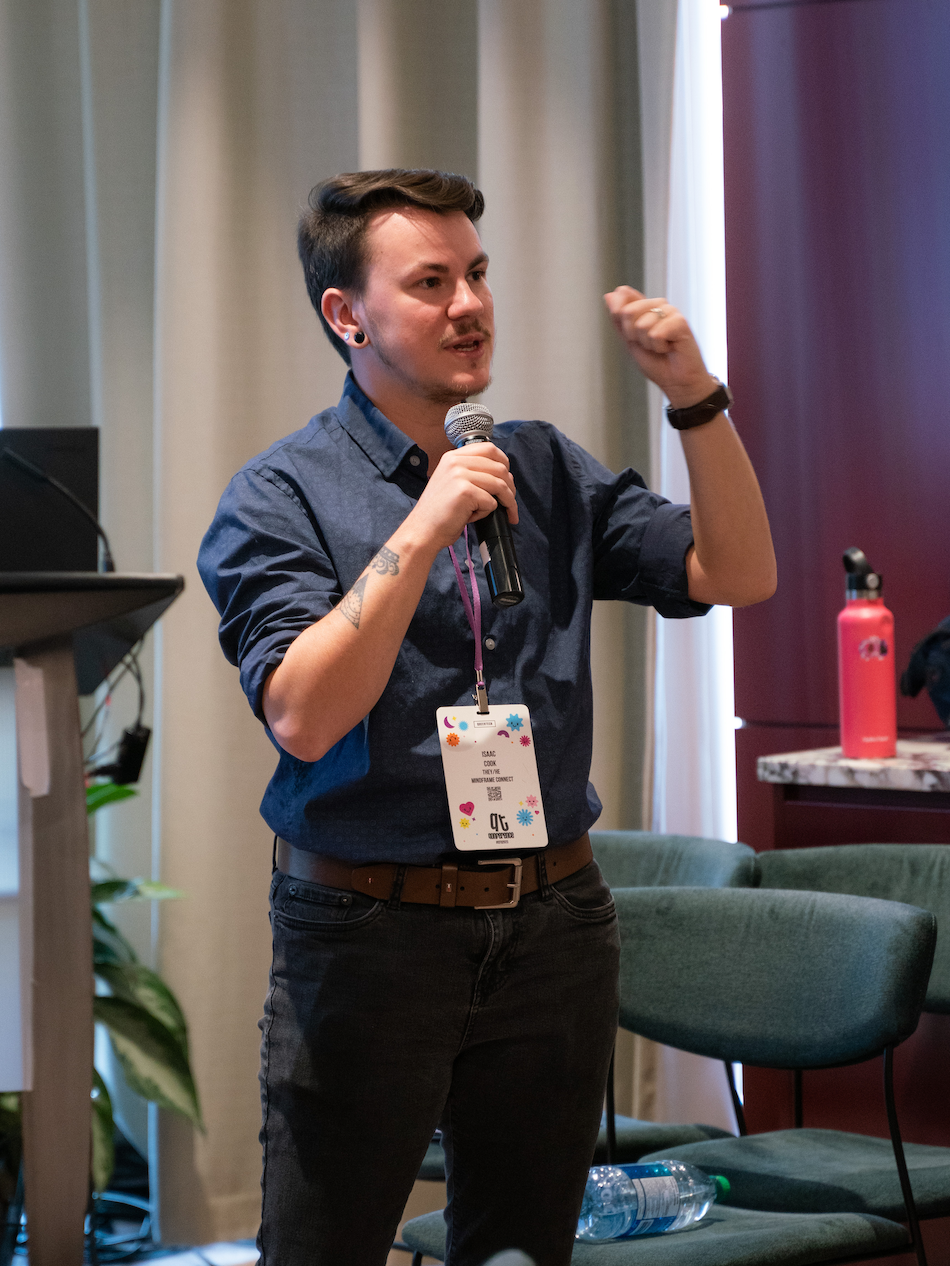 person standing with a microphone, talking